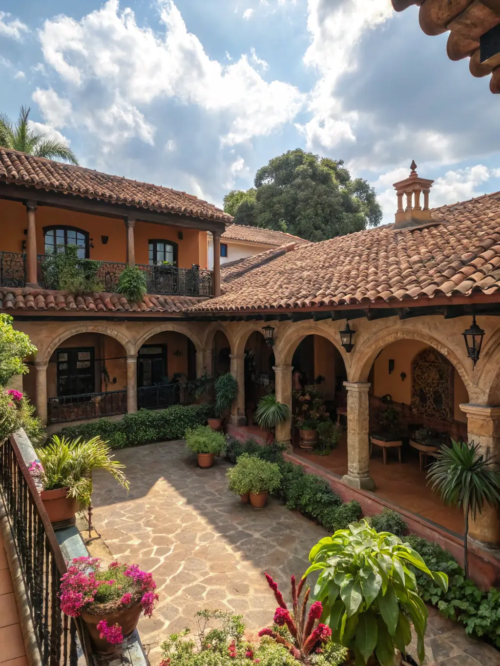 A charming traditional house in Guadalajara with a red tile roof and a lush garden.